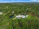 Bird's-eye view of the property showcasing the home and surrounding land at 7051 Turtle Ln, Sarasota, FL 34241