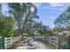 Long driveway leading to a single-Gathering home with a gated entrance at 7051 Turtle Ln, Sarasota, FL 34241