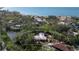 Aerial view of a property with some damage, showing its proximity to the beach at 7263 Plovers Way, Sarasota, FL 34242