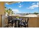 Private balcony with table and chairs, offering stunning city views at 750 N Tamiami Trl # 420, Sarasota, FL 34236