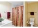 Clean bathroom with toilet, shower, and vanity at 750 N Tamiami Trl # 420, Sarasota, FL 34236