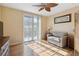 Bedroom with a sofa bed and access to a balcony at 750 N Tamiami Trl # 420, Sarasota, FL 34236
