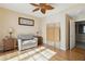 Bright guest room with sofa bed, wood floors, and large windows at 750 N Tamiami Trl # 420, Sarasota, FL 34236