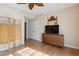 Guest room features wood floors, dresser, and a large TV at 750 N Tamiami Trl # 420, Sarasota, FL 34236