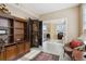 Home office with built-in shelving and access to another room at 750 N Tamiami Trl # 420, Sarasota, FL 34236