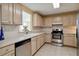 Kitchen boasts stainless steel appliances and light wood cabinets at 750 N Tamiami Trl # 420, Sarasota, FL 34236