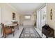 Bright living room with tiled floors and access to balcony at 750 N Tamiami Trl # 420, Sarasota, FL 34236