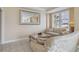 Living room with two sofas, a coffee table and large mirror at 750 N Tamiami Trl # 420, Sarasota, FL 34236