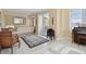 Spacious living room with balcony access and tiled floors at 750 N Tamiami Trl # 420, Sarasota, FL 34236