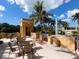 Outdoor patio with grill, tables, and chairs, perfect for entertaining at 750 N Tamiami Trl # 420, Sarasota, FL 34236