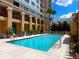 Enjoy resort-style living with this community pool and surrounding lounge chairs at 750 N Tamiami Trl # 420, Sarasota, FL 34236