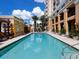Community pool with plenty of lounge chairs for relaxing in the Florida sun at 750 N Tamiami Trl # 420, Sarasota, FL 34236