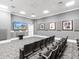 Community theater room with comfortable seating and large screen at 750 N Tamiami Trl # 420, Sarasota, FL 34236