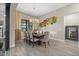 Bright dining room featuring a large wooden table and statement wall art at 7781 Grande Shores Dr, Sarasota, FL 34240