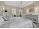 Luxurious main bedroom with large bed, ensuite bathroom access, and elegant decor at 7781 Grande Shores Dr, Sarasota, FL 34240