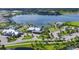 Aerial view of LakeHouse Cove community with lake, clubhouse, and pool at 8089 Sandstar Way, Sarasota, FL 34240