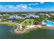 Aerial view of LakeHouse Cove with resort-style pool and clubhouse at 8089 Sandstar Way, Sarasota, FL 34240