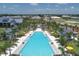 Community pool and surrounding amenities from above at 8089 Sandstar Way, Sarasota, FL 34240