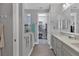 Spa-like bathroom with dual vanity, large walk-in shower, and walk-in closet at 8089 Sandstar Way, Sarasota, FL 34240