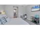 Bright bedroom with a comfortable bed, workspace, and large closet at 8089 Sandstar Way, Sarasota, FL 34240