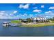 Aerial view of community boat dock and clubhouse at 8089 Sandstar Way, Sarasota, FL 34240