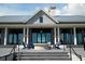 Elegant clubhouse with stone facade and inviting patio at 8089 Sandstar Way, Sarasota, FL 34240