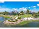 Aerial view of community clubhouse and lakefront at 8089 Sandstar Way, Sarasota, FL 34240