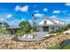 Community clubhouse with boat dock and lake access at 8089 Sandstar Way, Sarasota, FL 34240