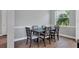 Elegant dining room with a dark wood table and gray upholstered chairs at 8089 Sandstar Way, Sarasota, FL 34240