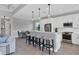 Bright kitchen, an island with seating, stainless steel appliances, and white cabinets at 8089 Sandstar Way, Sarasota, FL 34240