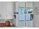 A window with a shelf in a modern kitchen setting at 8089 Sandstar Way, Sarasota, FL 34240