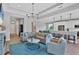 Open concept living room with kitchen and dining area visible at 8089 Sandstar Way, Sarasota, FL 34240