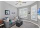 Cozy living room with comfortable seating and large windows at 8089 Sandstar Way, Sarasota, FL 34240