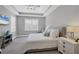 Spacious main bedroom with a king-size bed, and plenty of natural light at 8089 Sandstar Way, Sarasota, FL 34240
