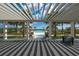 Resort-style pool at LakeHouse Cove with pergola and lounge area at 8089 Sandstar Way, Sarasota, FL 34240