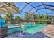Inviting pool and spa with a screened enclosure, offering privacy and relaxation at 8089 Sandstar Way, Sarasota, FL 34240