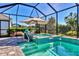 Enjoy this beautiful screened pool and spa with a waterfall feature at 8089 Sandstar Way, Sarasota, FL 34240