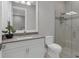 Elegant bathroom with a white vanity, gray countertop and a walk-in shower at 8544 Pavia Way, Bradenton, FL 34202