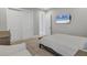 Charming bedroom with a queen bed and private access to a bathroom at 8544 Pavia Way, Bradenton, FL 34202
