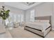 Spacious main bedroom with a king-size bed and access to a private patio at 8544 Pavia Way, Bradenton, FL 34202