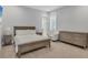 Cozy bedroom with a queen-size bed and plenty of storage at 8544 Pavia Way, Bradenton, FL 34202