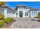 Luxury home with a gray roof and white exterior at 8544 Pavia Way, Bradenton, FL 34202