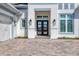 Modern double front doors with sidelights and paver walkway at 8544 Pavia Way, Bradenton, FL 34202