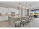 Gourmet kitchen boasting granite countertops and an island with seating at 8544 Pavia Way, Bradenton, FL 34202