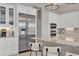 Well-equipped kitchen featuring stainless steel appliances and white cabinetry at 8544 Pavia Way, Bradenton, FL 34202