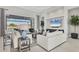 Bright and airy living room with a view of the lanai and pool at 8544 Pavia Way, Bradenton, FL 34202