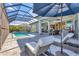 Luxury pool area with lounge chairs and umbrella at 8544 Pavia Way, Bradenton, FL 34202