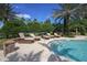 Tranquil pool area with comfortable lounge chairs at 8544 Pavia Way, Bradenton, FL 34202