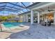 Large pool and patio with covered seating area at 8544 Pavia Way, Bradenton, FL 34202