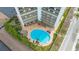 Aerial view showing building, pool, and surrounding area at 101 Benjamin Franklin Dr # 54, Sarasota, FL 34236